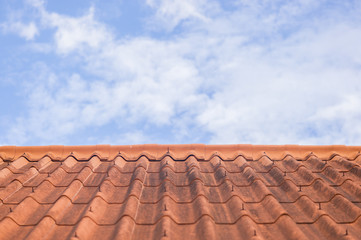 Roof tile on blue sky and white cloud background