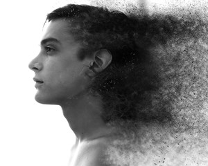 Photo manipulation of a black and white portrait of a nude man looking out into the distance as his layers fade away