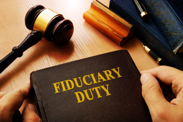 Hands holding Fiduciary duty in an court. - obrazy, fototapety, plakaty