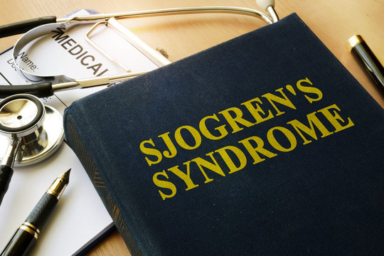 Book with title Sjogren's Syndrome on a table.