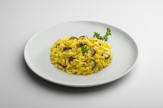 Plate of risotto with saffron and mushrooms