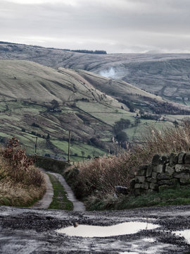 yorkshire moorland in winter with small lane and stone walls