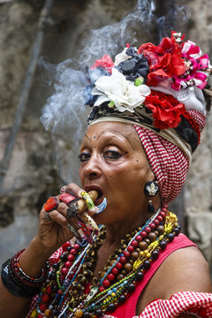 Woman smoking cigar, old Havana, Cuba.