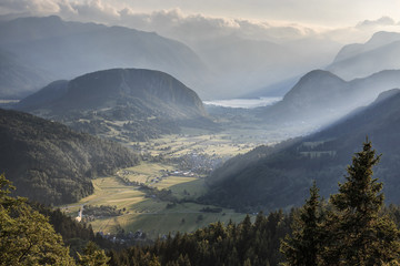 Aerial view of Bohinj lake at sunset in Julian Alps. Popular touristic destination in Slovenia not far from Lake Bled.