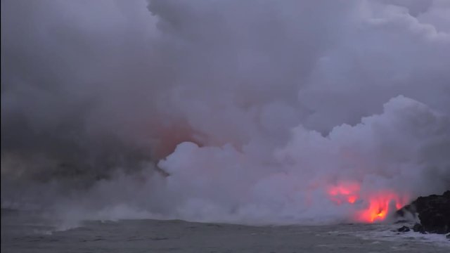 Lava flows into the ocean, Timelapse. Kilauea Volcano, Hawaii Big Island, USA.