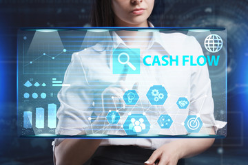 The concept of business, technology, the Internet and the network. A young entrepreneur working on a virtual screen of the future and sees the inscription: Cash flow
