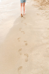 Young girl walking on the beach