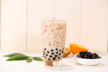 Boba / Bubble tea. Homemade Milk Tea with Pearls on wooden table.