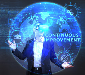 The concept of business, technology, the Internet and the network. A young entrepreneur working on a virtual screen of the future and sees the inscription: Continuous improvement