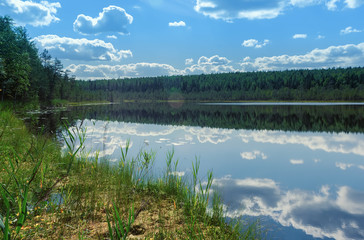 Summer Landscape With Sky Reflection On A Water