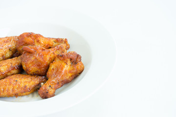 barbecue chicken wings close up on white background