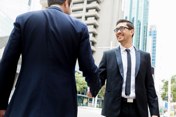 Two businessmen shaking their hands