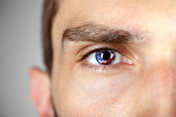 Obraz premium Beautiful blue man eye close up