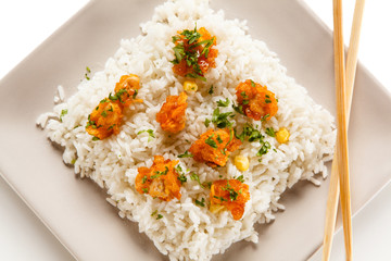 Chicken nuggets with rice on white background