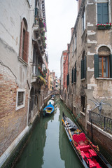 View of Gondola with building along the canal in Venice.