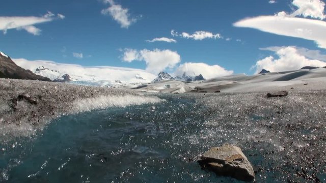 Pure transparent water of creek in snowy mountains and glacier in Antarctica. Amazing nature. Travel and tourism in world of wildlife.