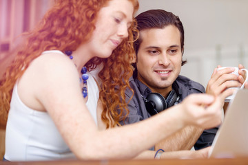 Two young people in office