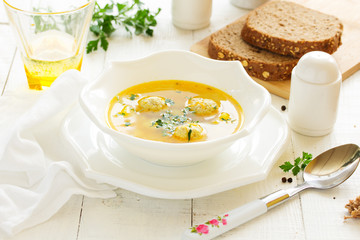 Homemade soup with chicken meatballs.