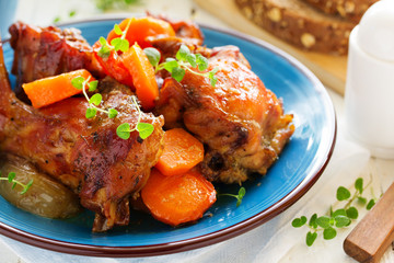 Baked rabbit with vegetables.