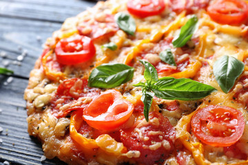 Close up view of tasty Italian pizza with basil