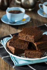 Chocolate Fudge Brownies with Hot Tea on Table