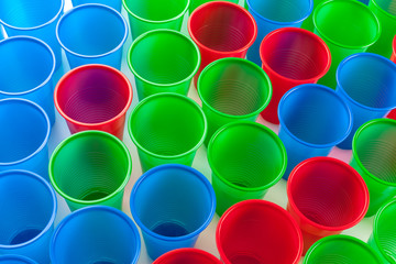 Multicolor plastic glasses isolated on white background