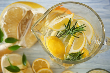 Jug with fresh lemonade, closeup