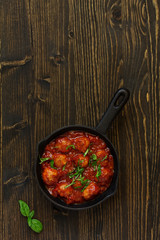 Homemade meatballs in tomato sauce.