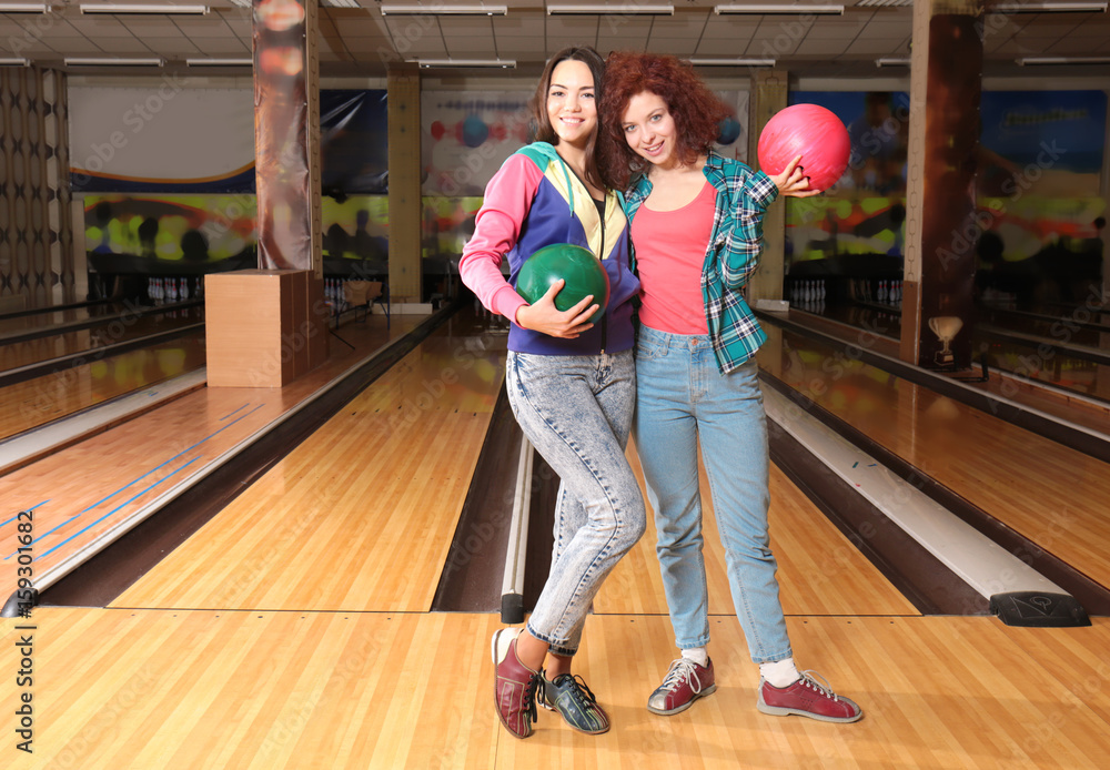 Wall mural friends having fun and playing bowling