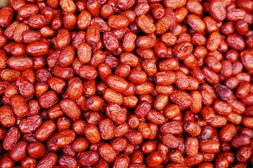 Red jujube fruit in bulk at the market