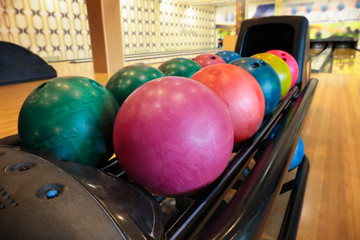 Colorful bowling balls in return machine