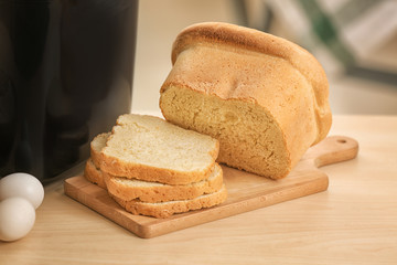 Tasty sliced loaf on table