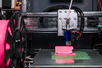 3d printer prints the model of the hand, like, the process of printing the hand on the 3d printer.
