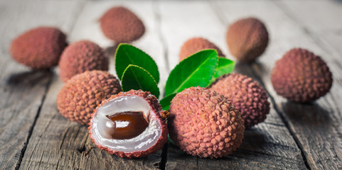 Lychees fruits on wooden background