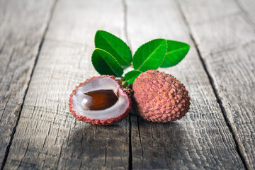 Lychees fruits on wooden background