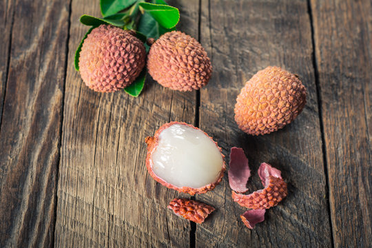 Lychees fruits on wooden background