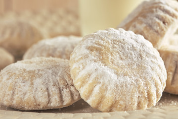 Closeup of homemade shortbread cookies covered with powdered sugar