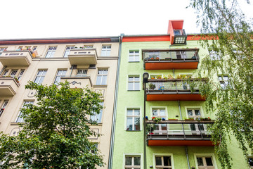 yellow and green apartment facade exterior