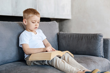 Brilliant amazing creative kid reading a book