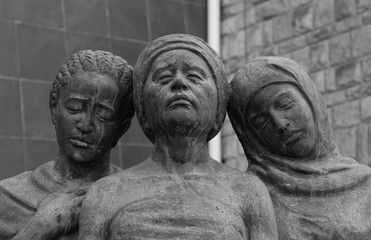 Statues of Women of Various Religions/Ethnicity Looking Sad