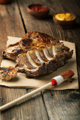 Grilled pork ribs with ketchup, mustard and garlic