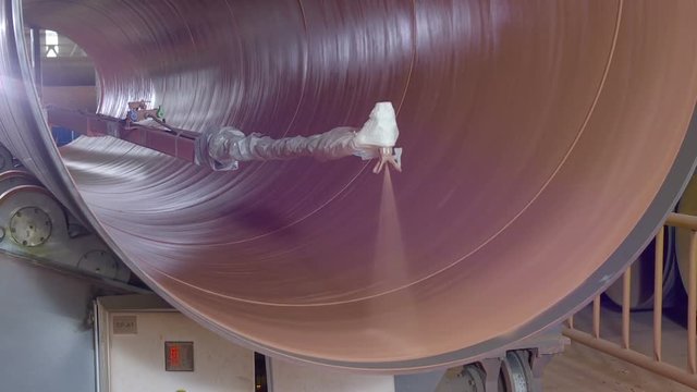 Automated machine paints the pipe from inside.