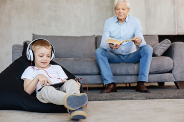 Two family generations enjoying similar hobbies