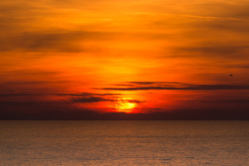 Naklejka na ściany i meble Colorful cloudy sunset at mediterranean sea