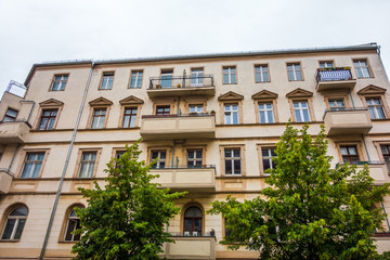 Fototapeta na wymiar big and orange apartment house at friedrichshain