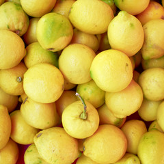 fresh lemons closeup top view at the local market