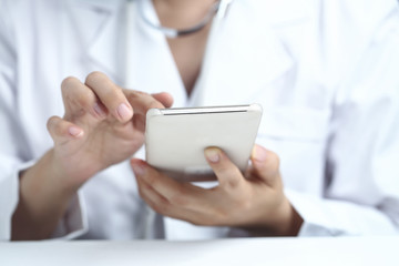 female doctor using cell phone