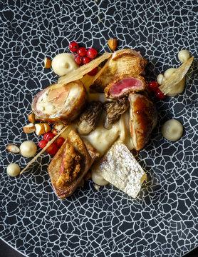 Quail, Black Salsify, Morel and Almonds dish at a restaurant, Prague, Czech Republic.