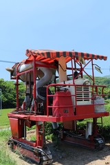 Tea picking machine with blue sky, located in Kagoshima, Japan