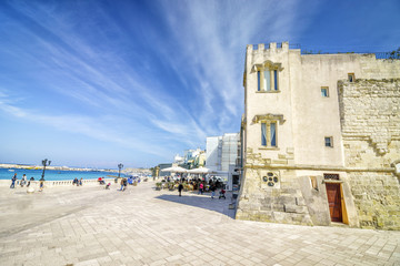 Seaside promenade with many tourists in Otranto, Italy